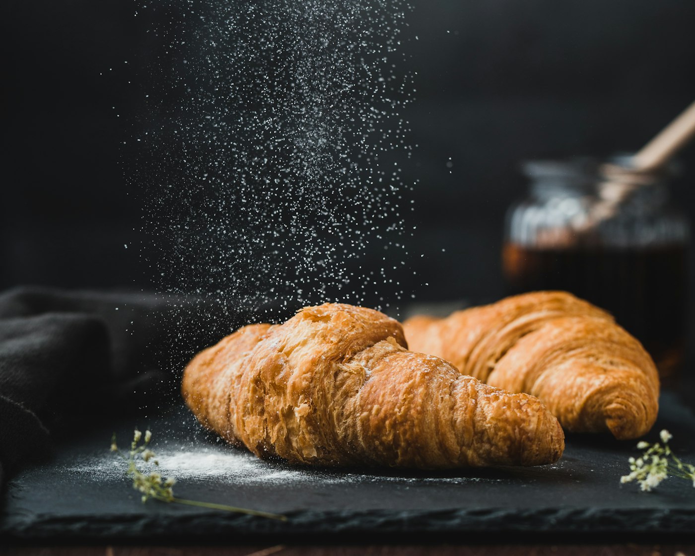Fresh croissants dusted with flour